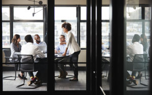 Business people sitting around a conference table