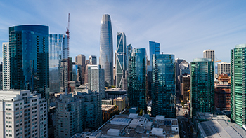 The skylines of New York City’s Lower Manhattan and Downtown Brooklyn, two major areas for real estate investment.